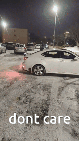 White Car with Dont Care Text in Snow