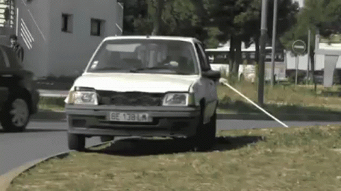 White Car With License Plate BE 138 LM