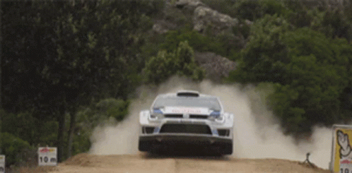 White Car with Red Bull Text Jumping