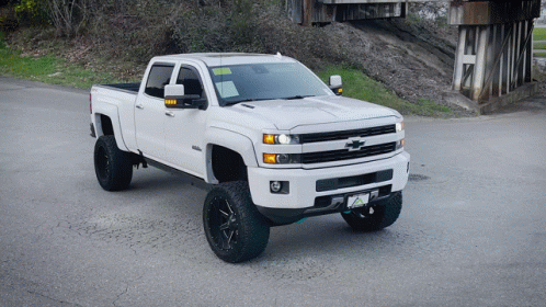 White Chevrolet Truck Parked on Side of Road