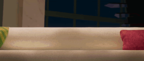 White Couch with Two Pillows in Dark Room