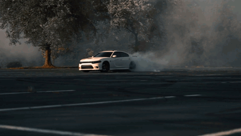 White Dodge Charger Driving GIF
