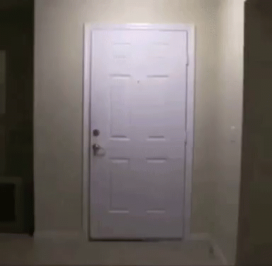 White Door Open in Hallway With Light