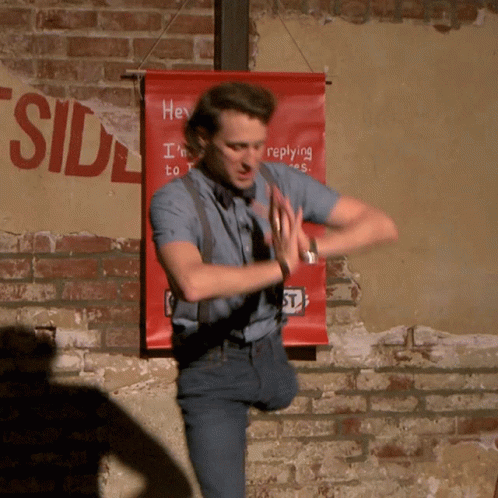 White Dress Man Dancing High Heels Netflix Logo