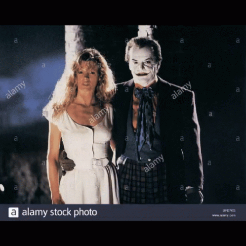 White Dress Woman Next to Joker Costume Man