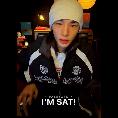 White Hat Black Jacket Person Saying I'm Sat