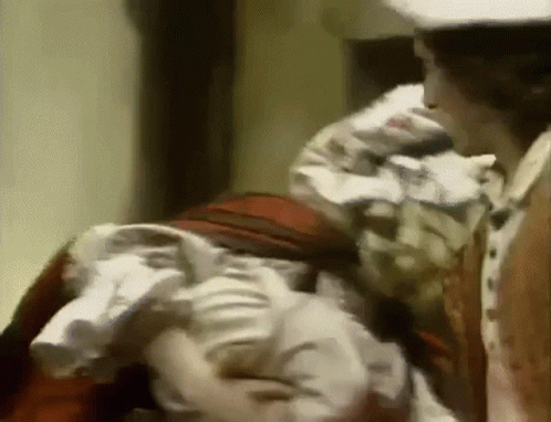 White Hat Man Near Red Dress Woman