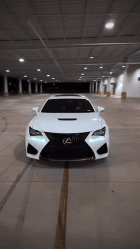 White Lexus Sports Car Parked in Parking Garage