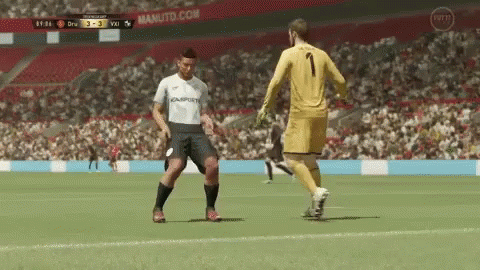 White Number 1 Soccer Player Beside Yellow Goalie