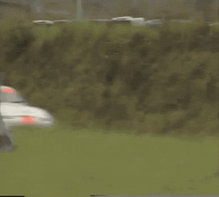 White Race Car With Red Stripe Driving GIF
