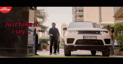 White Range Rover Parked at Building Saying Just Take It I Say