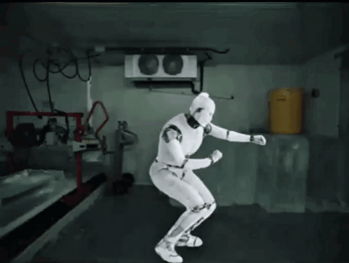 White Robot in Room with Yellow Barrel
