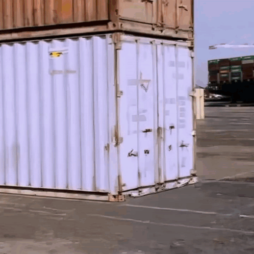 White Shipping Container with Yellow Sticker Saying A