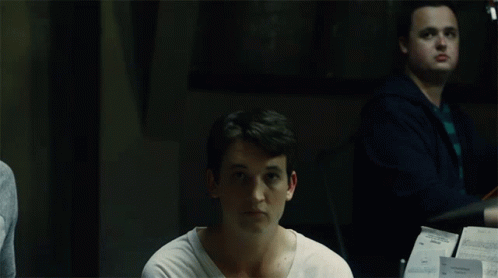 White Shirt Man Looking at Camera, Cello Player