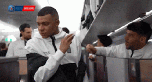 White Shirt Man Next to Black Shirt Man on Plane
