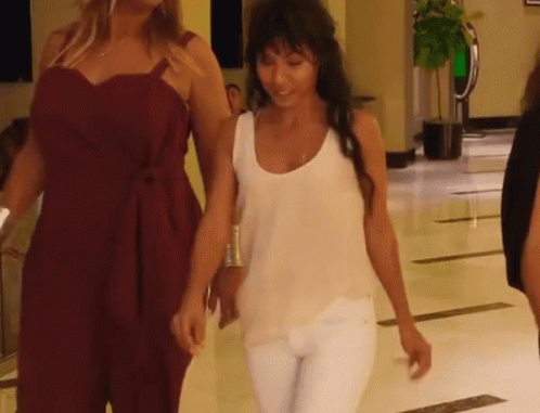 White Tank Top Woman Walking With Red Dress Woman GIF
