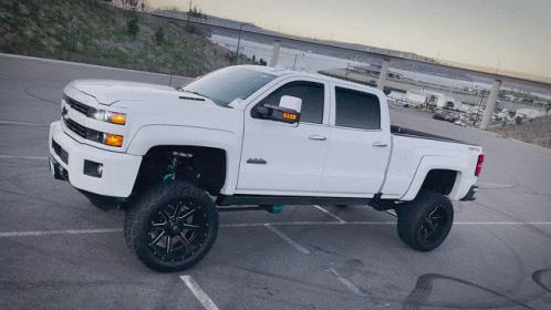 White Truck With Taxi on Side Parked