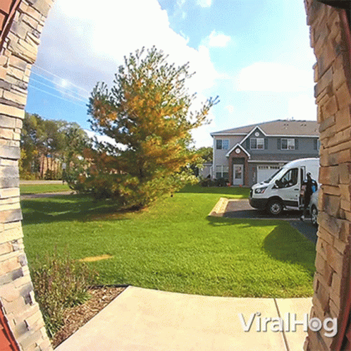 White Van Parked In Front Of House With Viralhog GIF
