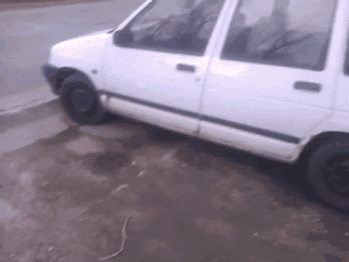 White Van Parked on Dirt Road