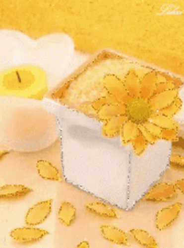 White Vase With Yellow Flower and Yellow Candle
