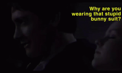 Why Are You Wearing That Stupid Man Suit Is Written In Yellow GIF