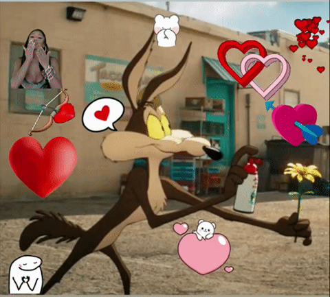 wile e coyote is surrounded by hearts and a flower