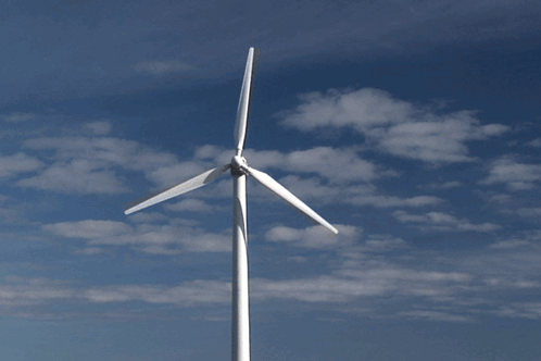 Wind Turbine Against Cloudy Blue Sky GIF