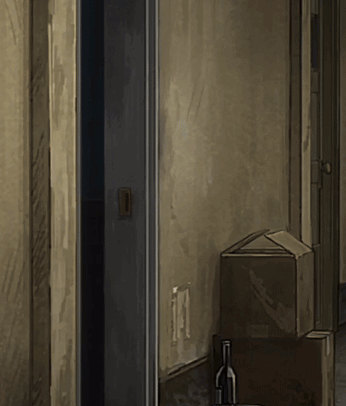 Wine Bottle on Table Next to Box in Hallway