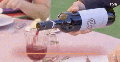 Wine Bottle Pouring Into Glass