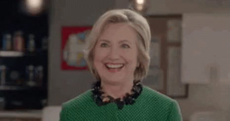 Winking Hillary Clinton In Green Blouse GIF