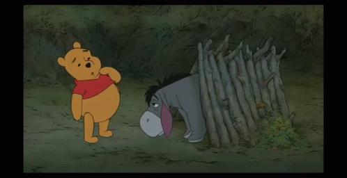 Winnie the Pooh and Eeyore Standing in Woods