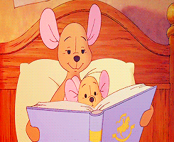 Winnie the Pooh and Piglet Reading Book on Bed