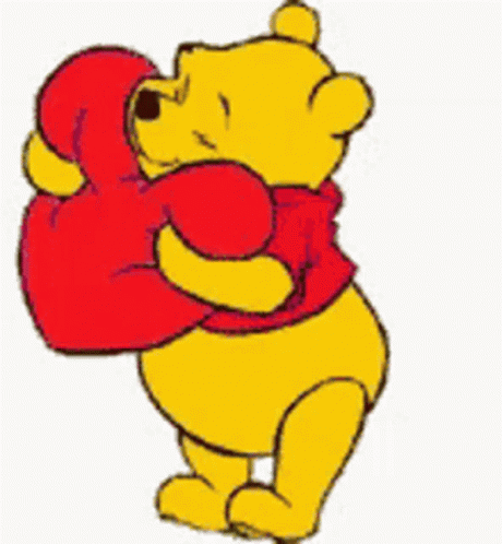 Winnie The Pooh Is Holding A Red Heart In His Mouth GIF