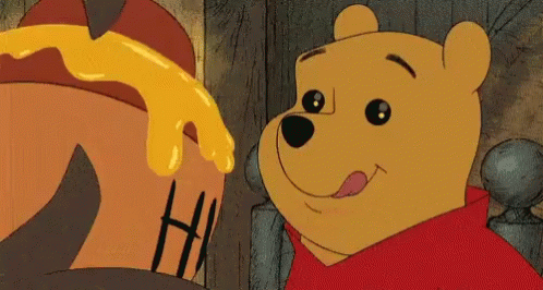 Winnie The Pooh Is Looking At A Pot Of Honey And Smiling GIF