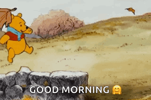 winnie the pooh is running in a field with an umbrella and leaves flying in the wind .