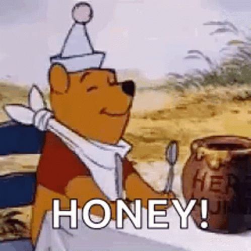 Winnie The Pooh Is Sitting At A Table Holding A Spoon Next To A Jar Of Honey . GIF
