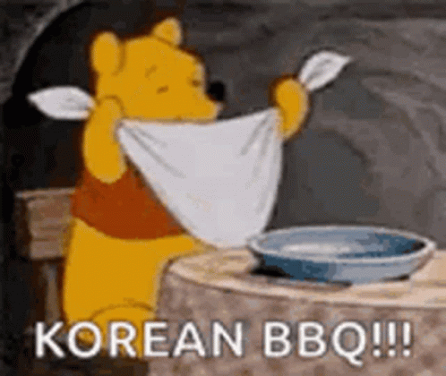 Winnie The Pooh Is Sitting At A Table Holding A Towel Over His Head And Saying `` Korean Bbq '' . GIF