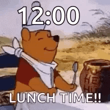 Winnie The Pooh Is Sitting At A Table With A Spoon In His Hand And A Jar Of Honey . GIF