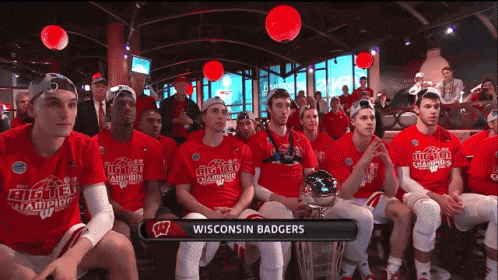 Wisconsin Badgers Basketball Players Sitting in Room