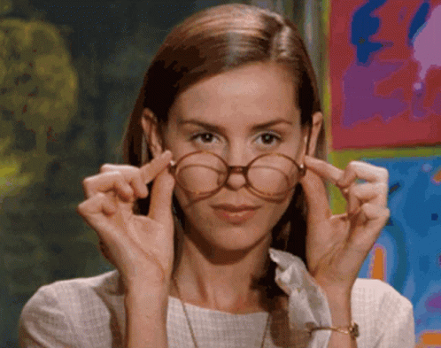 Woman Adjusting Glasses