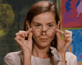 Woman Adjusting Glasses