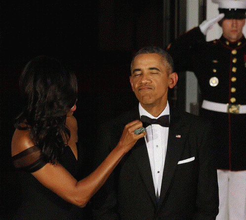 Woman Adjusting Man's Tie