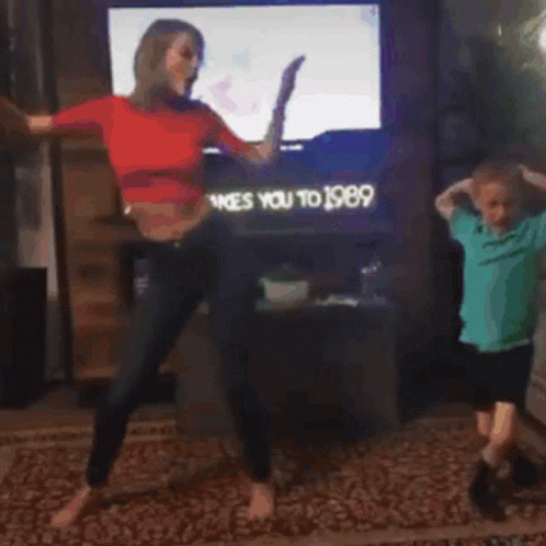 Woman and Boy Dancing in Front of TV Ty Takes You to 1989