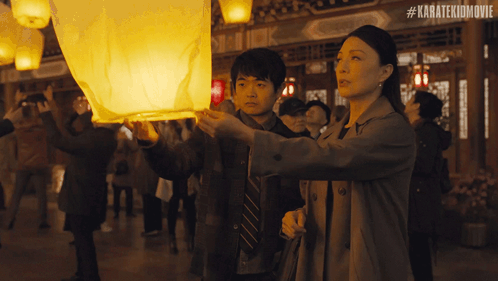 Woman And Boy Looking At Lantern #Karatekidmovie GIF