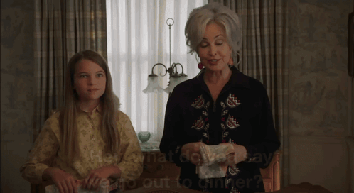 Woman and Girl Talking About Dinner