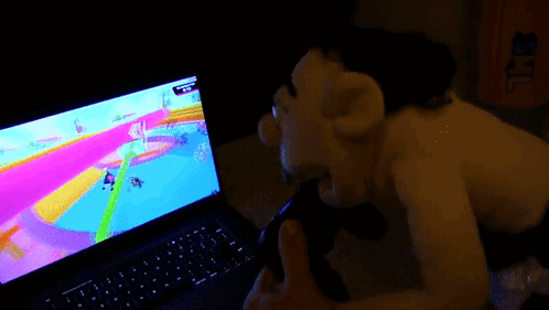 Woman and Little Girl Playing Video Game on Bed