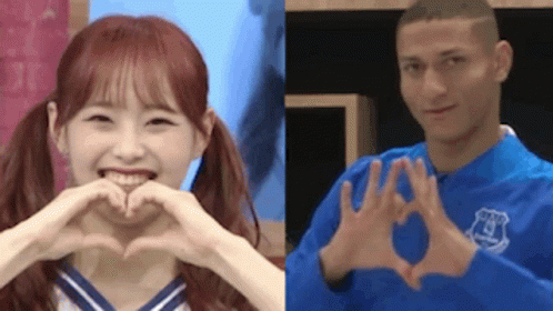 Woman and Man Making Heart Shapes