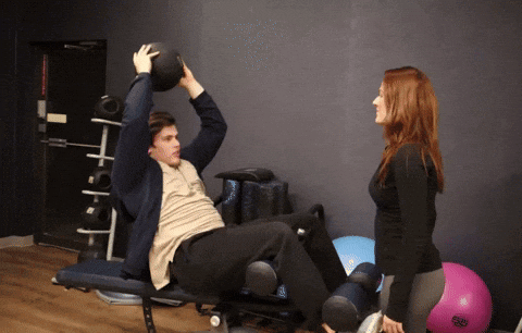 Woman and Man with Medicine Ball