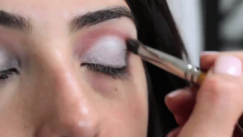 Woman Applying Eye Shadow with Brush
