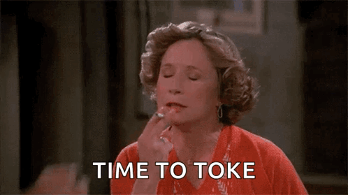 Woman Applying Lipstick Man Saying Time To Toke GIF